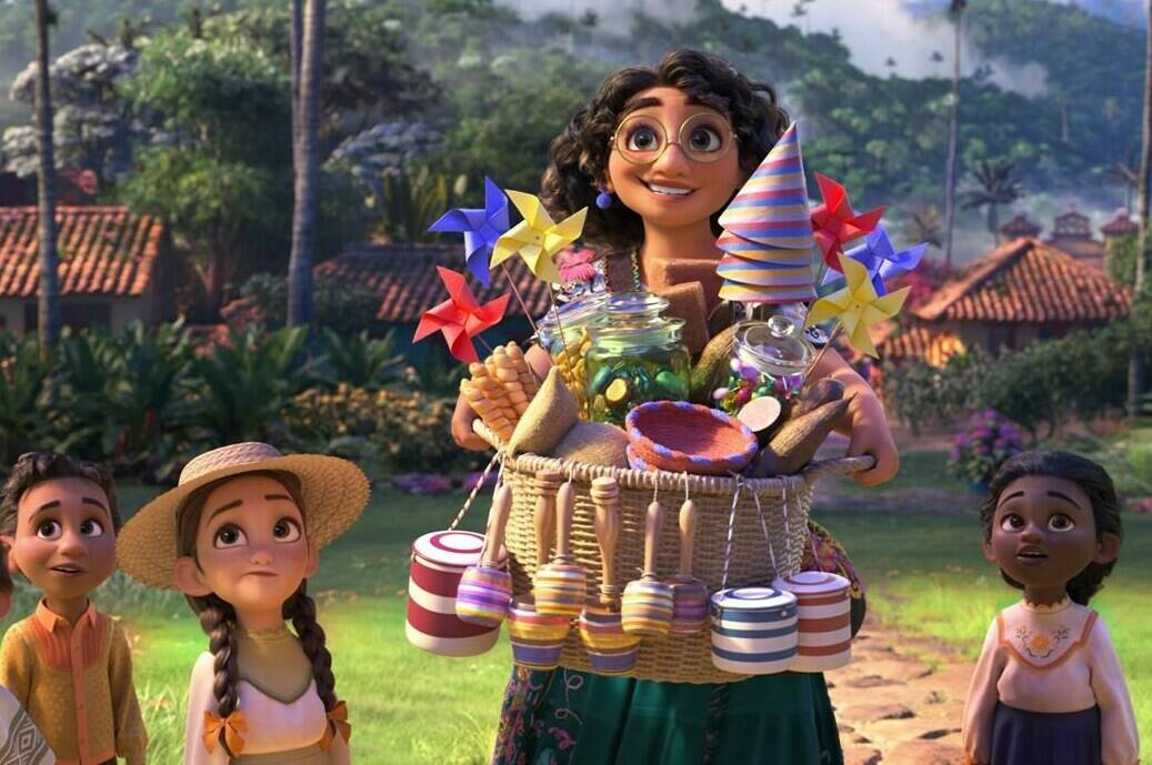 This image released by Disney shows Mirabel, voiced by Stephanie Beatriz, in a scene from the animated film “Encanto.” (Disney via AP)