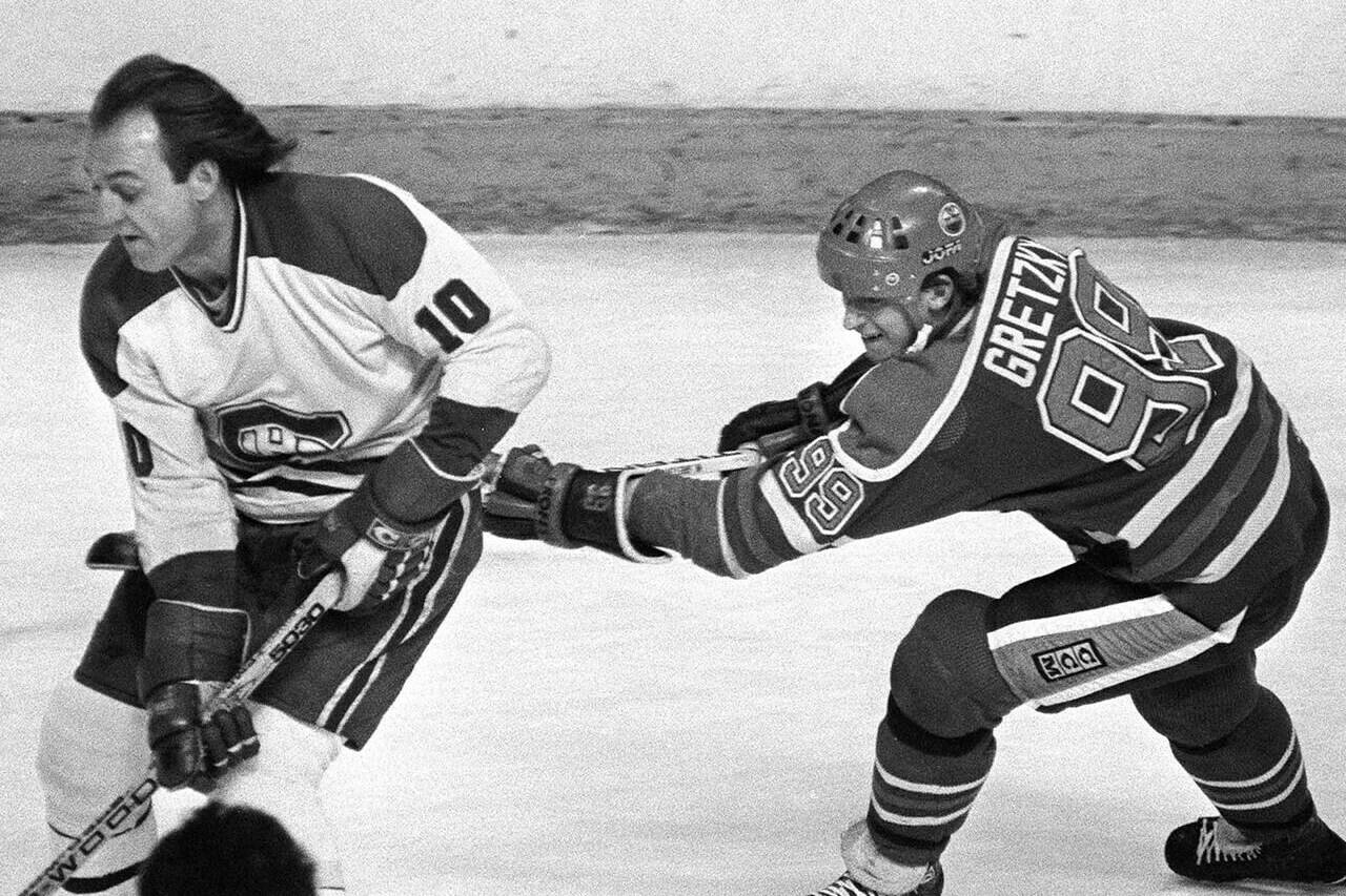 Edmonton Oilers Wayne Gretzky (right) checks Montreal Canadiens Guy Lafleur during NHL action in Montreal, March 2, 1982. THE CANADIAN PRESS/Ryan Remiorz