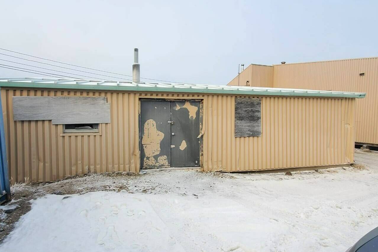 A storage shed used as a morgue in Gjoa Haven, Nvt., is seen on Wednesday, Nov. 3, 2021, in this image provided by Gjoa Haven resident James Dulac. With nowhere to put bodies, the community of about 1,300 people uses the old shed, which Dulac describes as a container with boarded up windows, as a morgue. THE CANADIAN PRESS/HO-James Dulac *MANDATORY CREDIT*