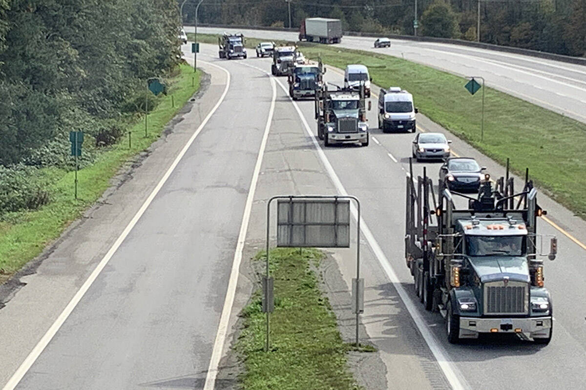 Logging trucks head down Highway 1 through Hope to join a convoy of drivers from across B.C. who were heading into Vancouver on Sept. 25, 2019. to protest provincial forestry policy. (Jessica Peters/Hope Standard)