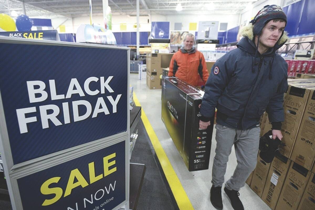 Consider if you really need something before you buy it on Black Friday, says a professor from University of B.C. Pictured here, a person at a sale from Black Friday 2016. (THE CANADIAN PRESS/Justin Tang)