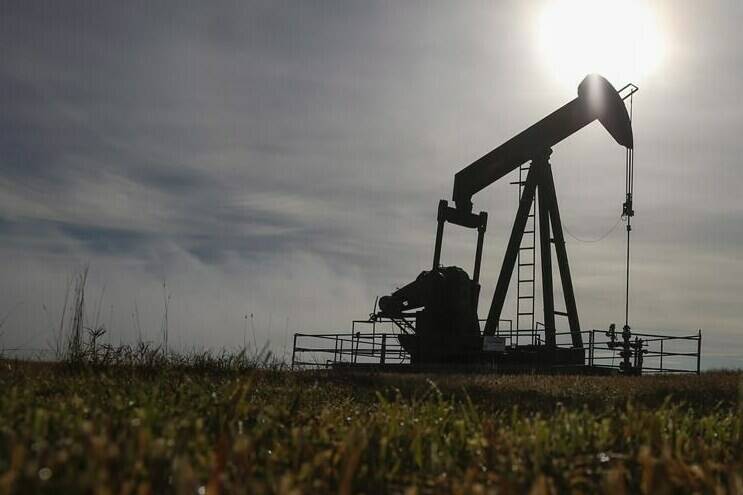 A pumpjack works at a well head on an oil and gas installation near Cremona, Alta., Saturday, Oct. 29, 2016. THE CANADIAN PRESS/Jeff McIntosh