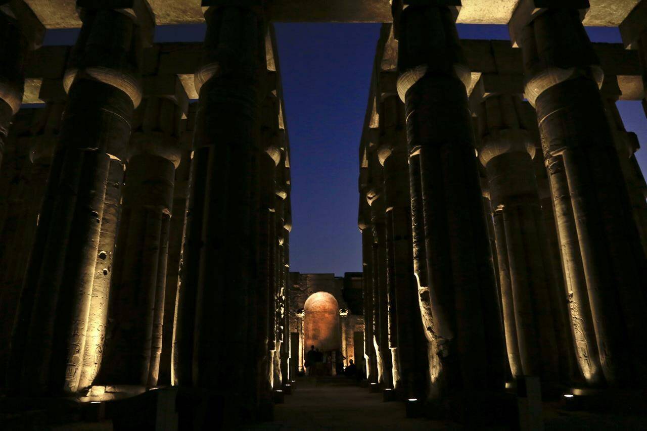 FILE - People visit the Luxor Temple in Egypt, Saturday, Sept. 9, 2017. Egyptian authorities are poised to unveil a renovated ancient promenade that dates back 3,000 years. The ceremony on Thursday, Nov. 25, 2021, is meant to highlight the country’s archaeological treasures as Egypt struggles to revive its tourism industry, battered by years of political turmoil and more lately, the coronavirus pandemic.(AP Photo/Nariman El-Mofty, File)