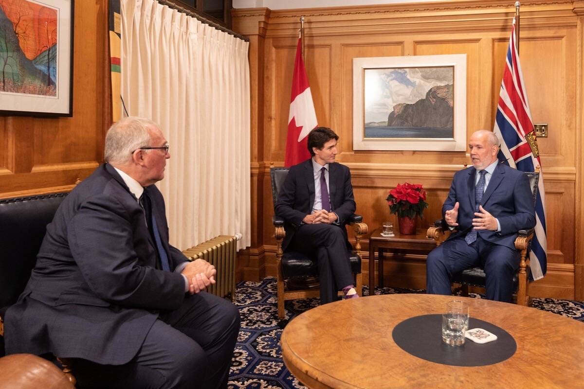 Federal Public Safety Minister Bill Blair (left), Prime Minister Justin Trudeau and B.C. Premier John Horgan meet at the premier’s office in Victoria after touring flooding in the Fraser Valley, Nov. 26, 2021. (B.C. government photo)