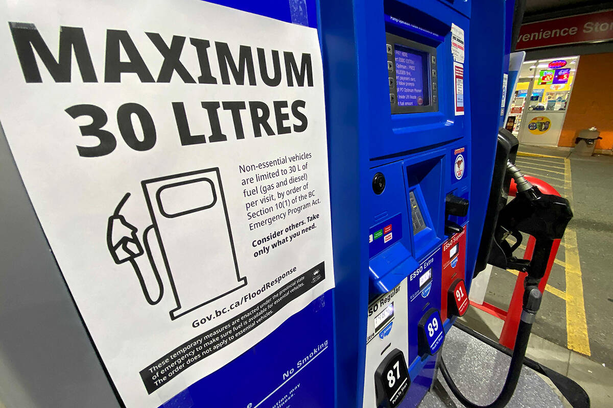 A sign showing limits on consumer gasoline purchases is seen on a fuel pump at a gas station in Abbotsford, B.C., Tuesday, Nov. 23, 2021. THE CANADIAN PRESS/Jonathan Hayward