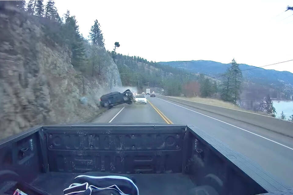 Brendan Miller’s dashcam caught an SUV driving over the centre lane, overtaking vehicles before losing control and slamming into the rocks on Highway 97 just outside of Peachland on Friday, Nov. 26, 2021. (Brendan Miller video)