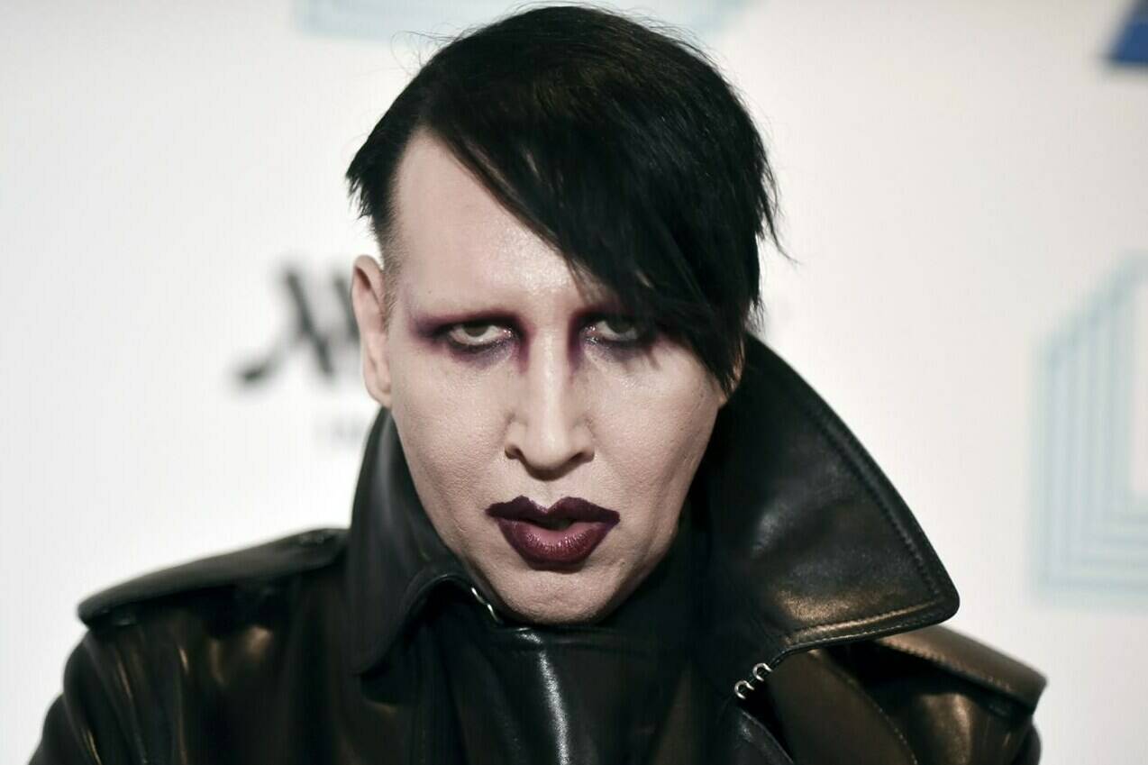 FILE - Marilyn Manson attends the 9th annual “Home for the Holidays” benefit concert in Los Angeles, on Dec. 10, 2019. Authorities searched the home of the rocker on Monday, Nov. 29, 2021, after allegations of physical and sexual abuse by several women. (Photo by Richard Shotwell/Invision/AP, File)