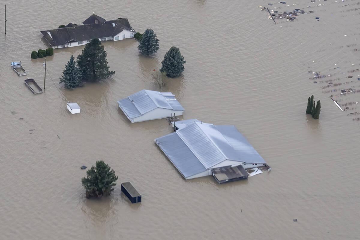 Flood waters surround a farm in Abbotsford, B.C., Tuesday, Nov. 23, 2021. THE CANADIAN PRESS/Jonathan Hayward