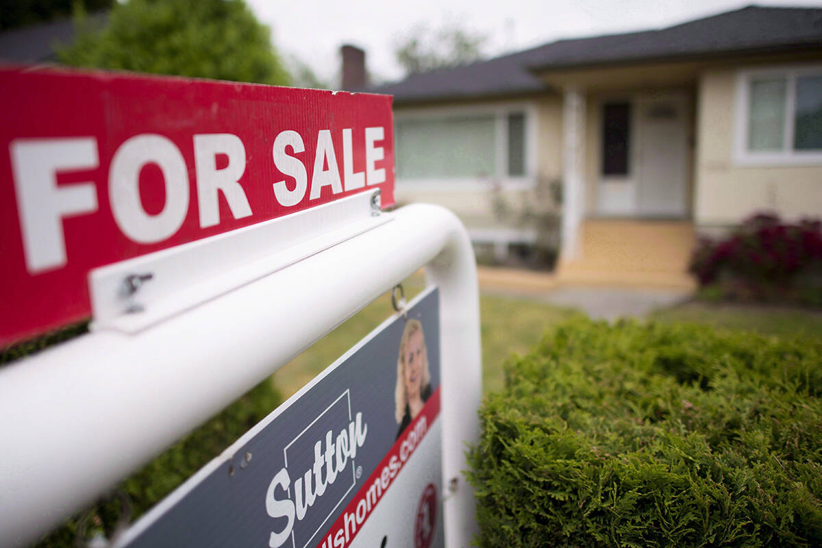The Real Estate Board of Greater Vancouver says home sales activity in the area for the month of October remain below long-term historical averages. A real estate sign is pictured in Vancouver, B.C., Tuesday, June, 12, 2018. THE CANADIAN PRESS Jonathan Hayward