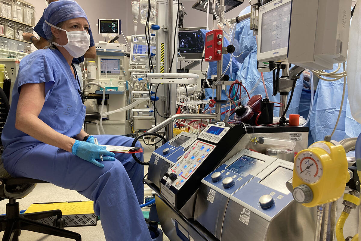 Newly trained perfusionist Kris Hromadnik working during a coronary arterial bypass case. (Supplied by Roger Stanzel)