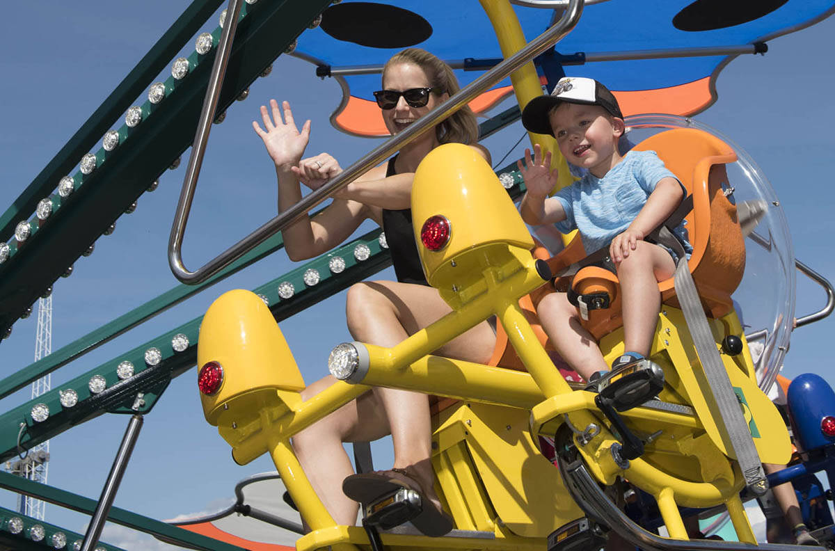 White Rock residents Karen Arsenault and four year-old Dylan Arsenault at the Pacific National Exhibition midway in 2017. (PNE photo)