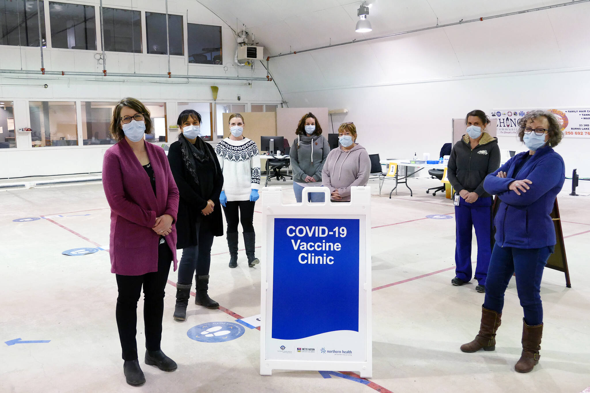 Northern Health staffers and volunteers at community COVID-19 vaccination clinic, at the arena in Burns Lake B.C., March 2021. Northern B.C. continues to have lower vaccination rates than the rest of the province, and higher virus transmission. (Priyanka Ketkar/Lakes District News)