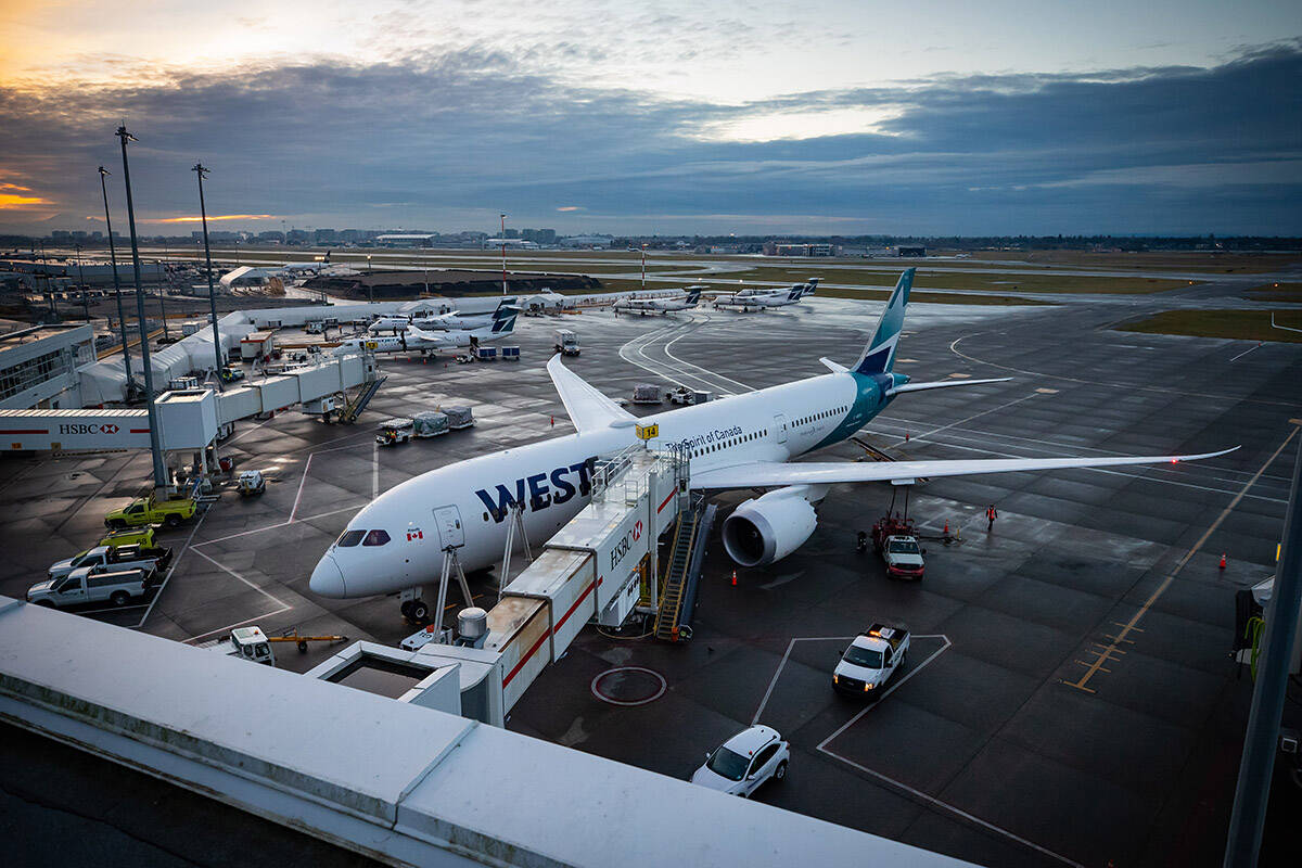 A WestJet Airlines Boeing 787-9 Dreamliner is seen parked at a gate at Vancouver International Airport, in Richmond, B.C., on Thursday, January 21, 2021. THE CANADIAN PRESS/Darryl Dyck