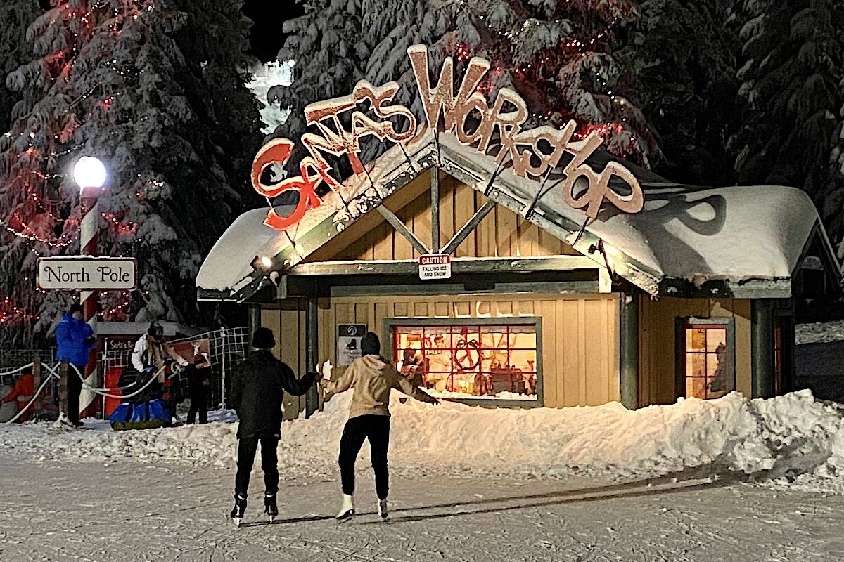Skaters glide by Santa’s Workshop at Grouse Mountain’s Peak of Christmas attraction on Wednesday, Dec. 15. (Photo: Tom Zillich)