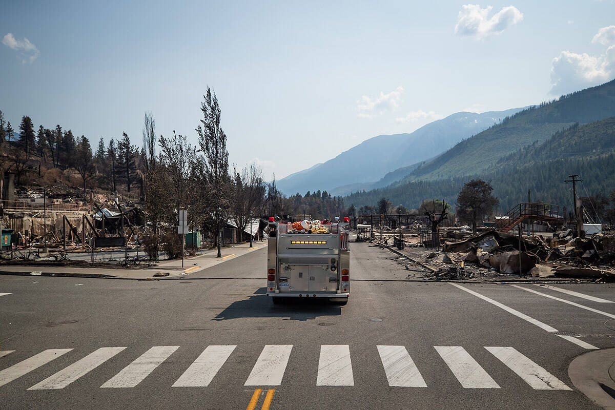 A fire truck leads a bus down Main Street past damaged structures during a media tour in Lytton, B.C., on Friday, July 9, 2021, after a wildfire destroyed most of the village on June 30. THE CANADIAN PRESS/Darryl Dyck
A fire truck leads a bus down Main Street past damaged structures during a media tour in Lytton, B.C., on Friday, July 9, 2021, after a wildfire destroyed most of the village on June 30. THE CANADIAN PRESS/Darryl Dyck