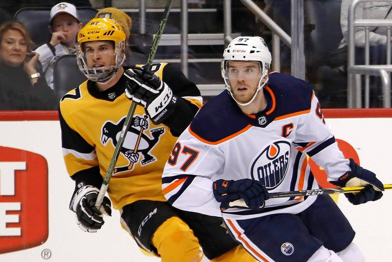Edmonton Oilers’ Connor McDavid (97) and Pittsburgh Penguins’ Sidney Crosby (87) skate during the second period of an NHL hockey game in Pittsburgh, Saturday, Nov. 2, 2019. The Oilers won 2-1 in overtime. THECANADIAN PRESS/AP-Gene J. Puskar