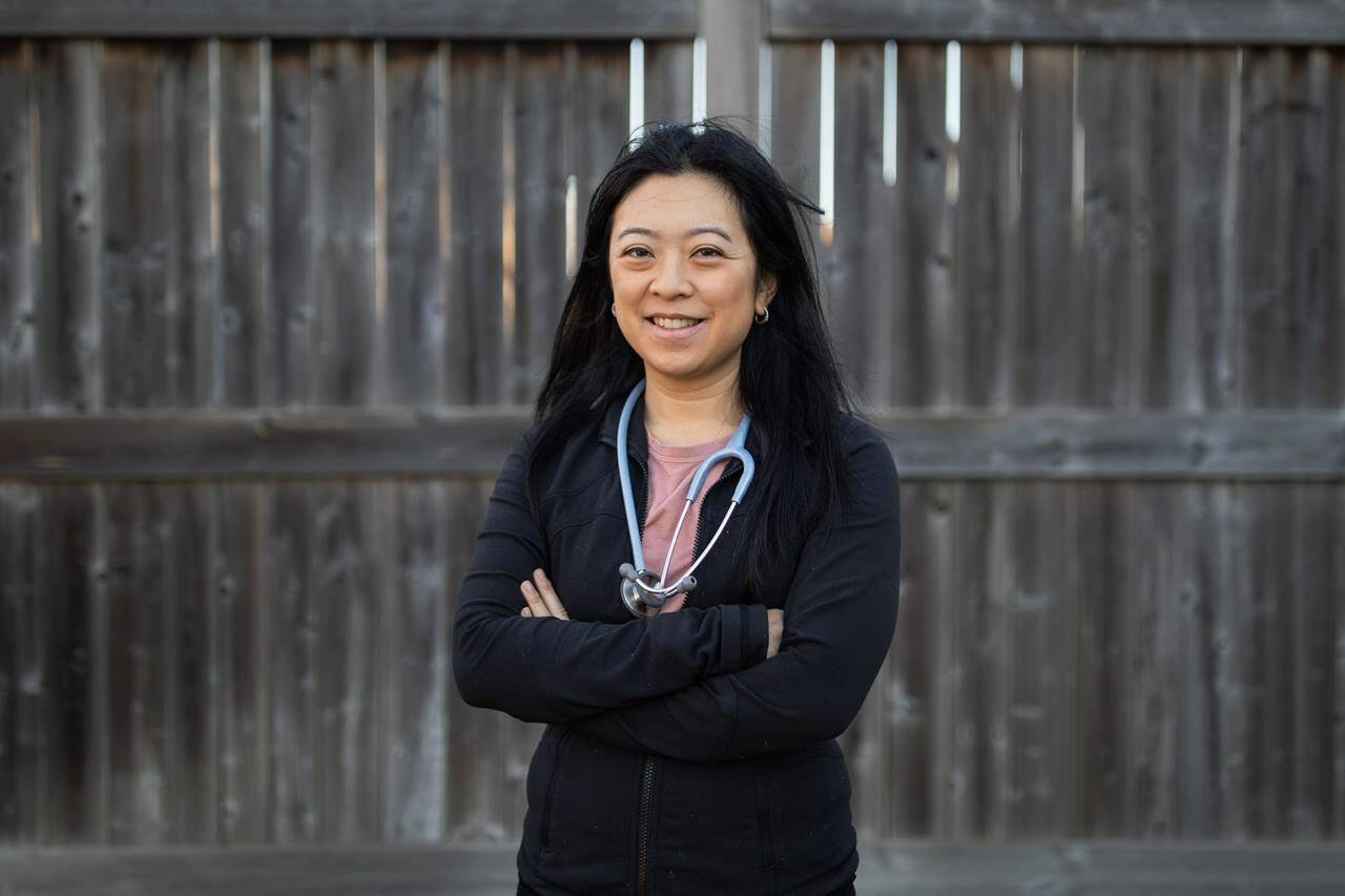 Registered Nurse Sara Fung poses for a photo in Binbrook, Ont., on Monday, December 13, 2021. Fung was overcome with emotion when the first COVID-19 vaccines started pouring into Canada last December, and again in March when she received her first dose. As she felt the prick of the needle on her arm, the Hamilton-area nurse thought of the grandmother she lost to COVID-19 nearly a year earlier. THE CANADIAN PRESS/Nick Iwanyshyn