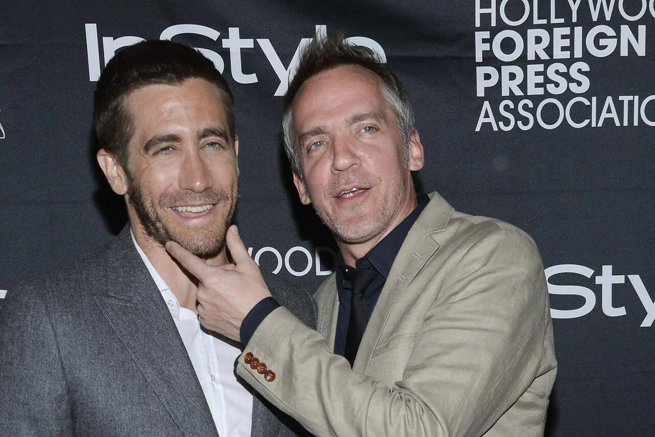 FILE - Actor Jake Gyllenhaal, left, and director Jean-Marc Vallée attend the Hollywood Foreign Press Association and InStyle party at the Windsor Arms Hotel during the Toronto International Film Festival on Sept. 6, 2014, in Toronto. Director and producer Jean-Marc Vallée, who won an Emmy for directing the hit HBO series “Big Little Lies” and whose 2013 drama “Dallas Buyers Club” earned multiple Oscar nominations, has died, his representative Bumble Ward said Sunday, Dec. 26, 2021. He was 58. (Photo by Evan Agostini/Invision/AP, File)