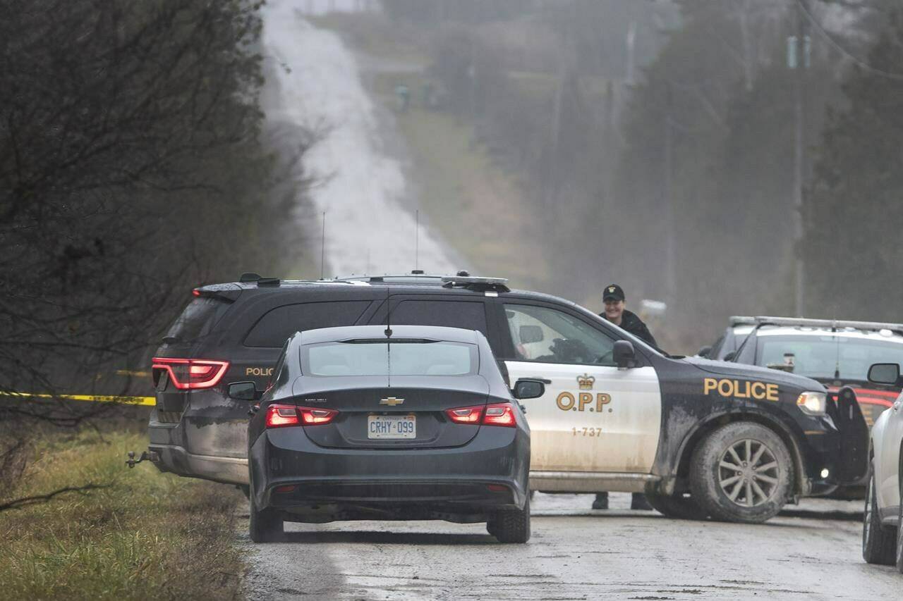 Ontario Provincial Police attend a rural shooting scene in Kawartha Lakes, Ont., on Thursday, Nov. 25, 2021. Despite growing calls for changes in policing, the number of officer shootings in Canada remains too high, say criminology experts.THE CANADIAN PRESS/Fred Thornhill