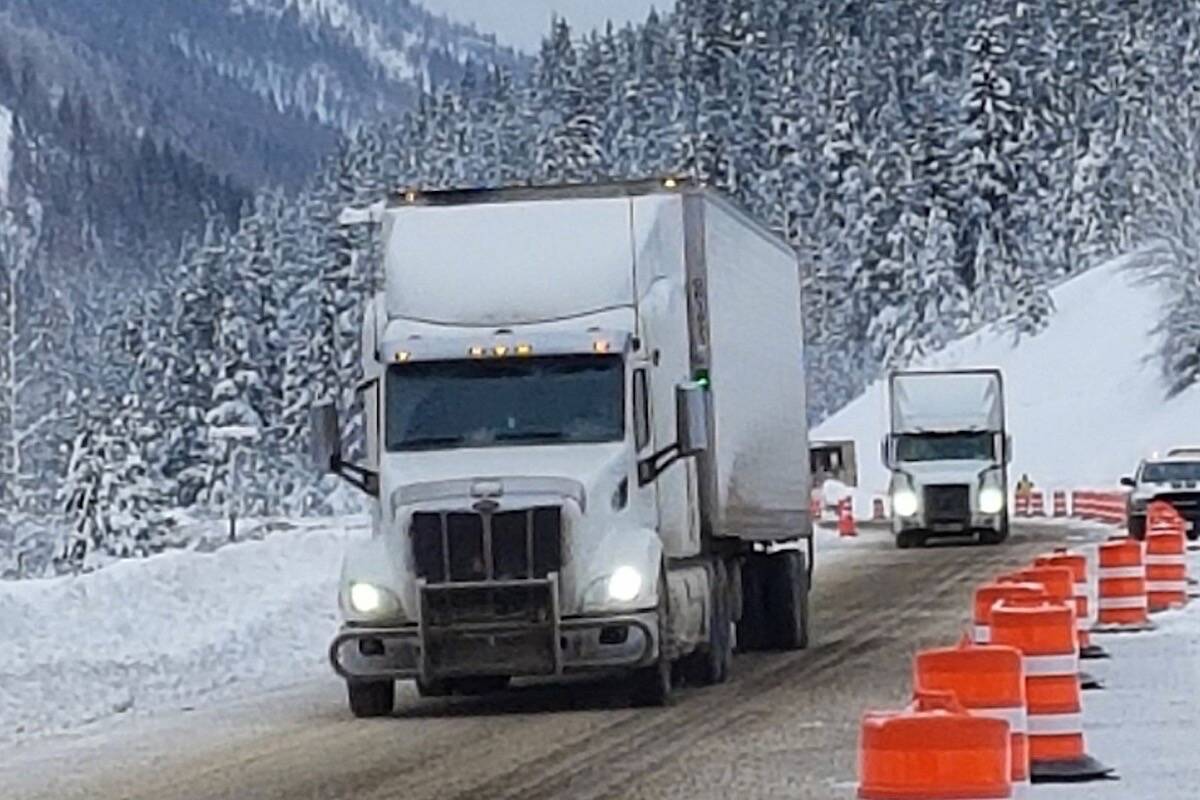 Commercial trucks begin making their way through the Coquihalla Highway between Hope and Merritt Dec. 21, 2021. (B.C. government photo)