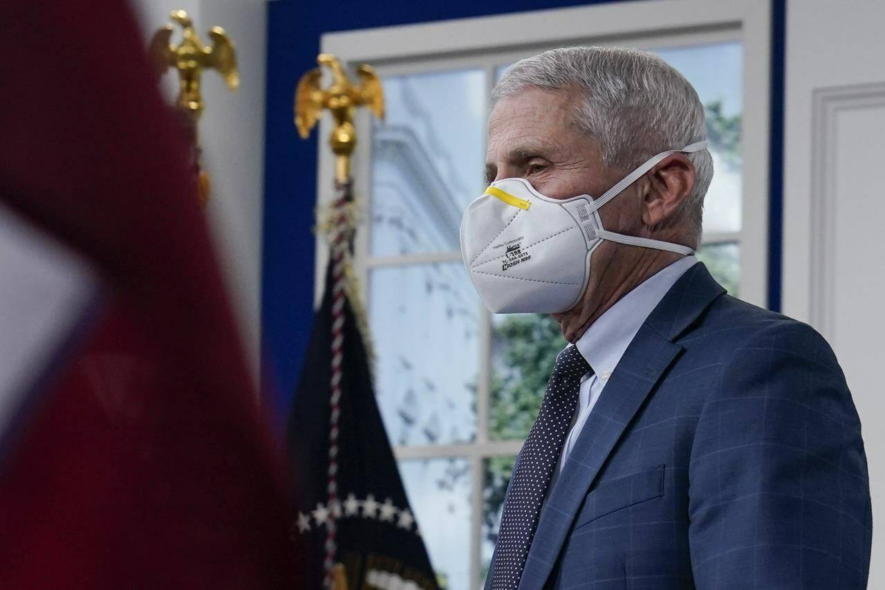 Dr. Anthony Fauci, the top U.S. infectious disease expert, wears a face mask as he arrives for the the White House COVID-19 Response Team’s regular call with the National Governors Association in the South Court Auditorium in the Eisenhower Executive Office Building on the White House Campus, Monday, Dec. 27, 2021, in Washington. Fauci says the U.S. should consider a vaccination mandate for domestic air travel as coronavirus infections surge. To date the Biden administration has balked at the idea, anticipating legal entanglements. (AP Photo/Carolyn Kaster)