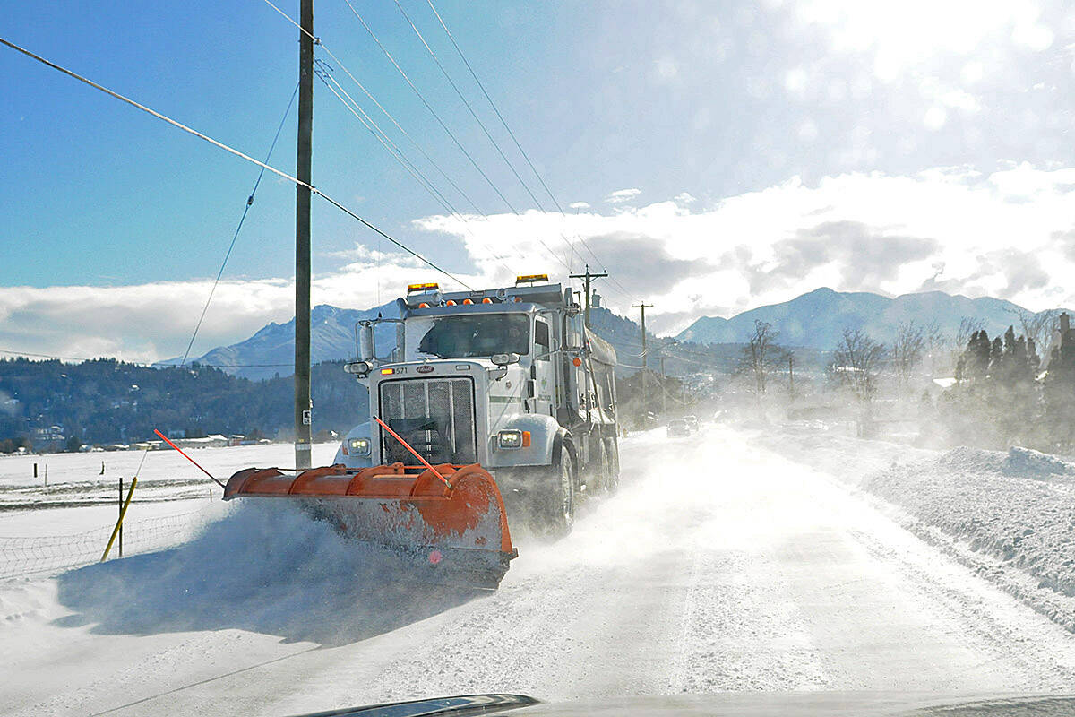 A snow plow clears drifting snow along Prest Road in Chilliwack in this 2019 file shot. (Jenna Hauck/Chilliwack Progress file)