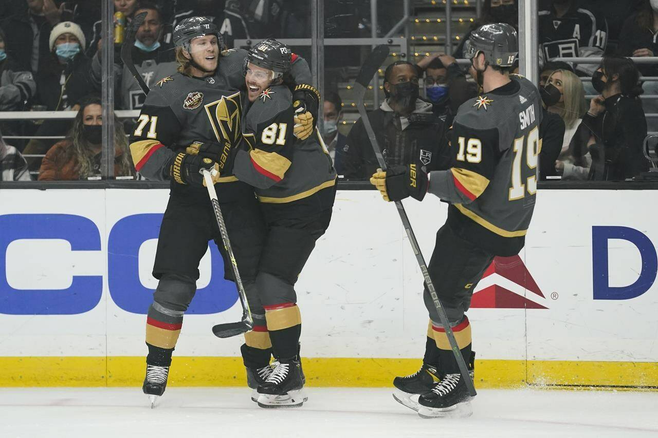Vegas Golden Knights center Jonathan Marchessault (81) celebrates with center William Karlsson (71) after scoring during the first period of the team’s NHL hockey game against the Los Angeles Kings on Tuesday, Dec. 28, 2021, in Los Angeles. (AP Photo/Ashley Landis)