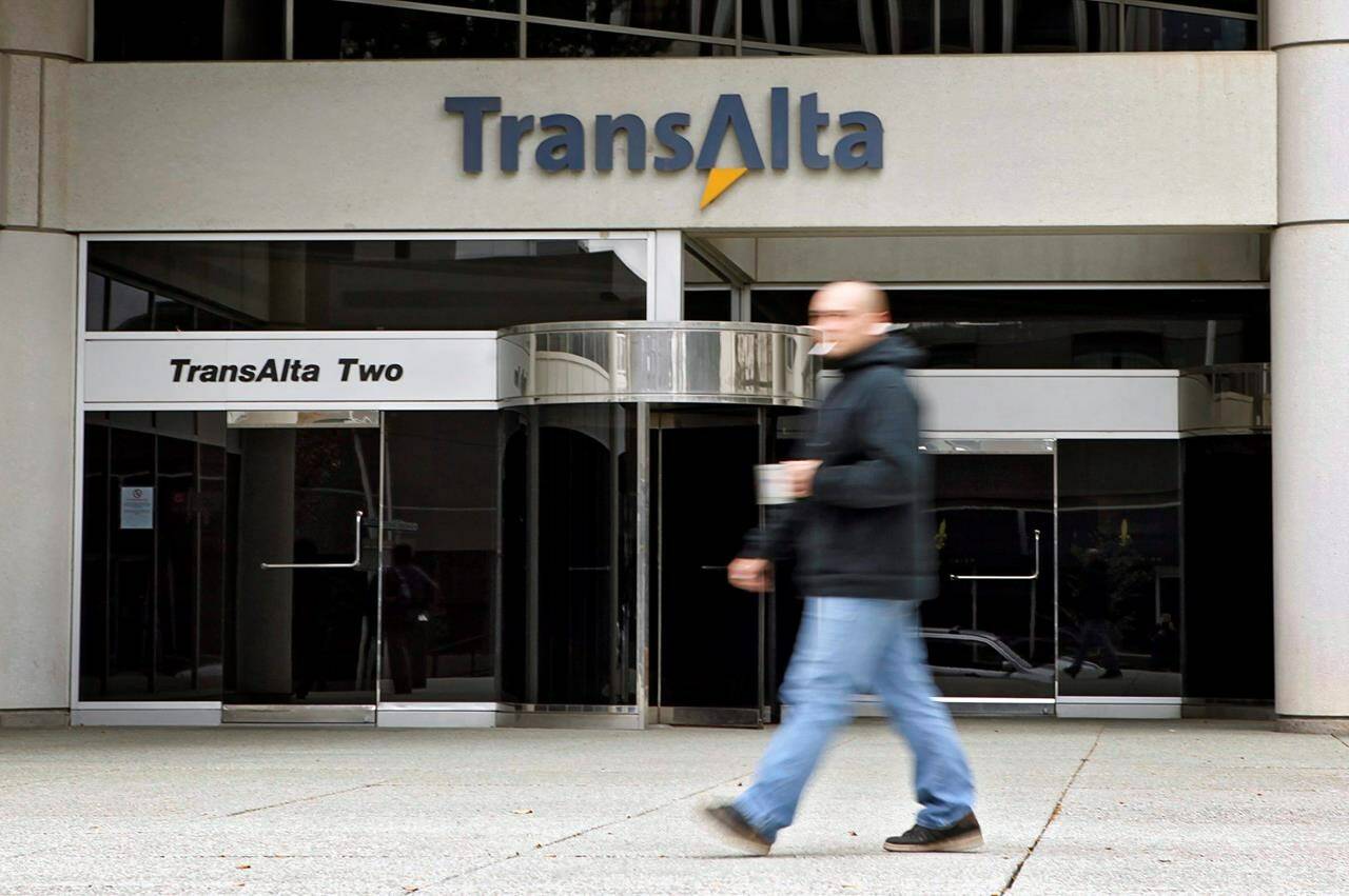 A pedestrian walks past the TransAlta building in downtown Calgary, Monday, Oct. 5, 2009. THE CANADIAN PRESS/Jeff McIntosh