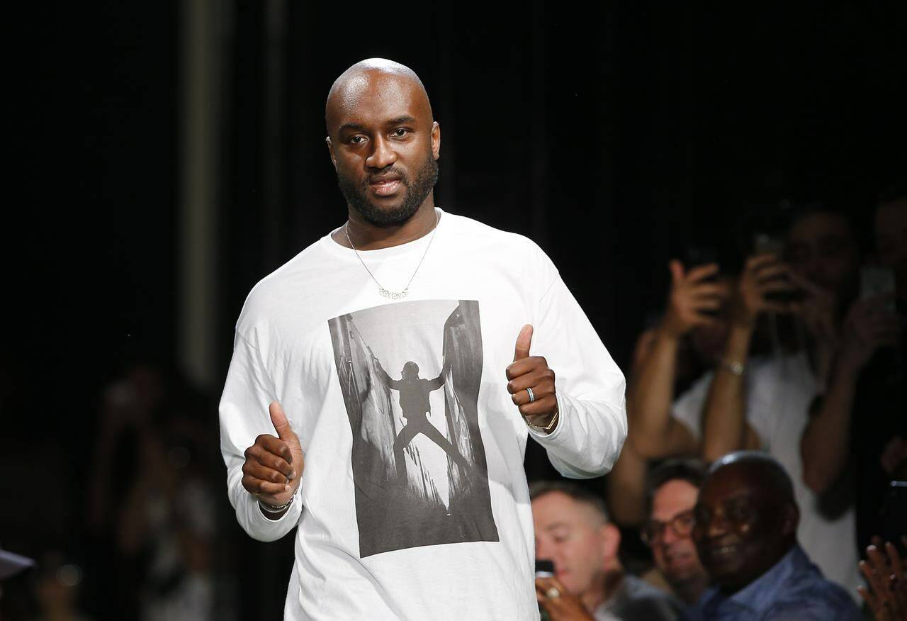 FILE - Fashion designer Virgil Abloh gives a thumbs up after the presentation of Off-White Men's Spring-Summer 2019 collection presented in Paris, Wednesday June 20, 2018. Abloh, a leading fashion executive hailed as the Karl Lagerfeld of his generation, died Nov. 28, 2021, after a private battle with cancer. He was 41. (AP Photo/Thibault Camus, File)