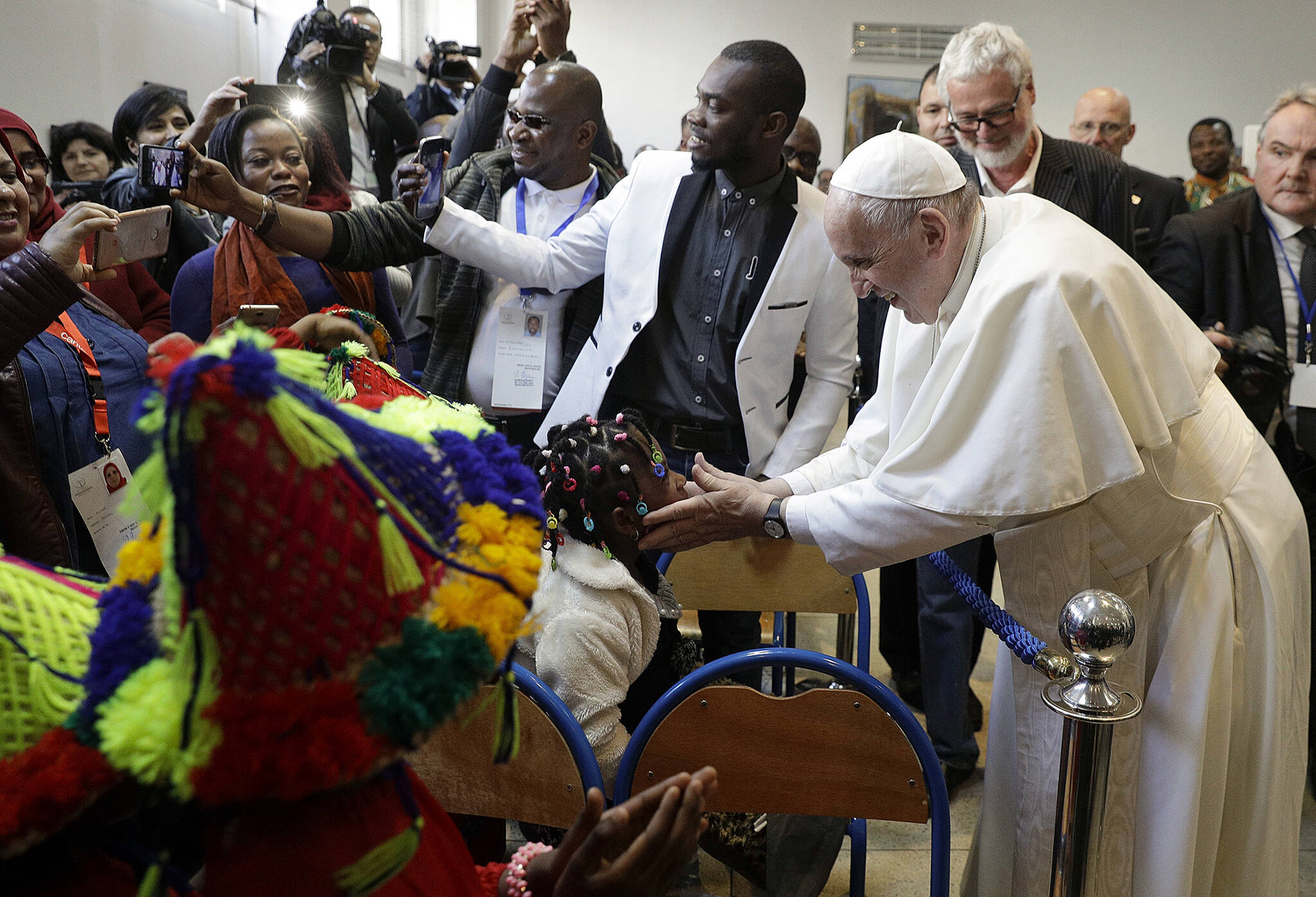 Pope Francis meets migrants at the diocesan Caritas center in Rabat, Morocco, Saturday, March 30, 2019. Francis’s weekend trip to Morocco aims to highlight the North African nation’s tradition of Christian-Muslim ties while also letting him show solidarity with migrants at Europe’s door and tend to a tiny Catholic flock on the peripheries. (AP Photo/Gregorio Borgia)