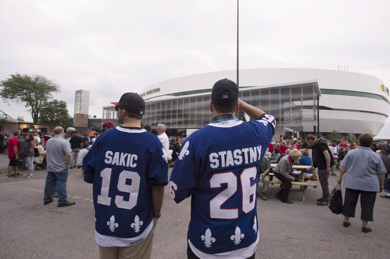 Quebec Nordiques fans wait outside the Videotron Centre where the first-ever hockey game, a QMJHL game between the Quebec Remparts and the Rimouski Oceanic ,will be played, Saturday, September 12, 2015 in Quebec City. Quebec politicians are meeting with National Hockey League brass in January, but it’s unclear what influence the government can have on the league or whether team owners have any interest in bringing the Nordiques back to the provincial capital.THE CANADIAN PRESS/Jacques Boissinot