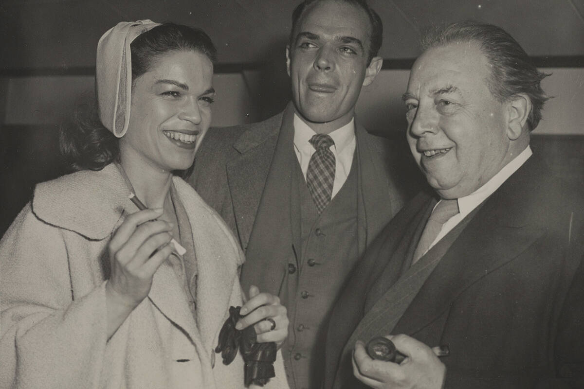 British playwright J.B. Priestley greets Canadian actors Murray Davis and Barbara Chilcott on their arrival at London airport. (Associated Press)