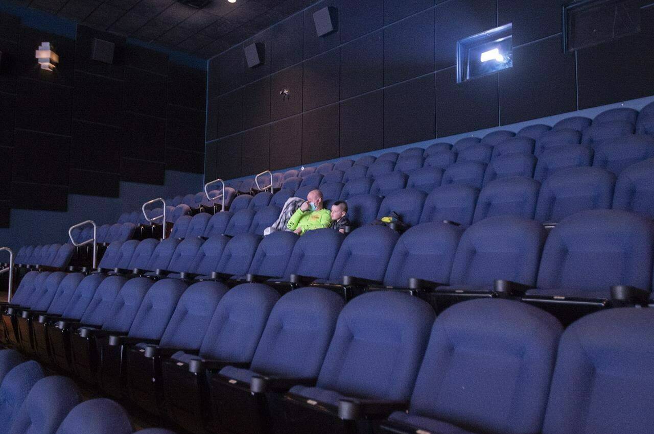 A few customers watch a movie at a Cineplex movie theatre in Laval, Que., Friday, Feb. 26, 2021. THE CANADIAN PRESS/Ryan Remiorz