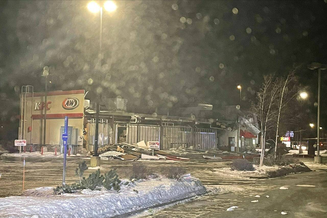 In this photo provided by the Wasilla Police Department, is a combined KFC and A&W fast-food building, which had one wall missing and debris piled in the drive-thru lane after a wind storm in Wasilla, Alaska on Sunday, Jan. 2, 2022. Destructive winds continued to batter an area just north of Anchorage for a third day, flipping small airplanes and semitrailers, forcing schools to close, leaving thousands without power and severely damaging a fast-food restaurant. (Wasilla Police Department via AP)