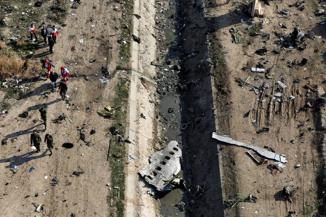 Rescue workers search the scene where a Ukrainian plane crashed in Shahedshahr, southwest of the capital Tehran, Iran, on January 8, 2020. An Ontario court has awarded more than $107 million to families of six victims of the Iranian military’s downing of a passenger jet two years ago. The decision made public today follows a May ruling that the missile strikes amounted to an intentional act of terrorism, paving the way for relatives of those killed to seek compensation from Iran. THE CANADIAN PRESS/AP, Ebrahim Noroozi