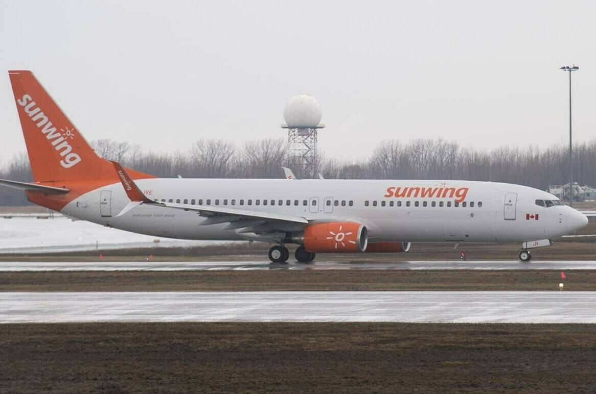 A Sunwing Airlines jet prepares to take off at Montreal’s Trudeau International Airport, Friday, March 20, 2020. Federal Transport Minister Omar Alghabra says he has asked Transport Canada to investigate reports of “unacceptable” behaviour on a recent Sunwing Airlines flight to Cancun, Mexico.THE CANADIAN PRESS/Graham Hughes