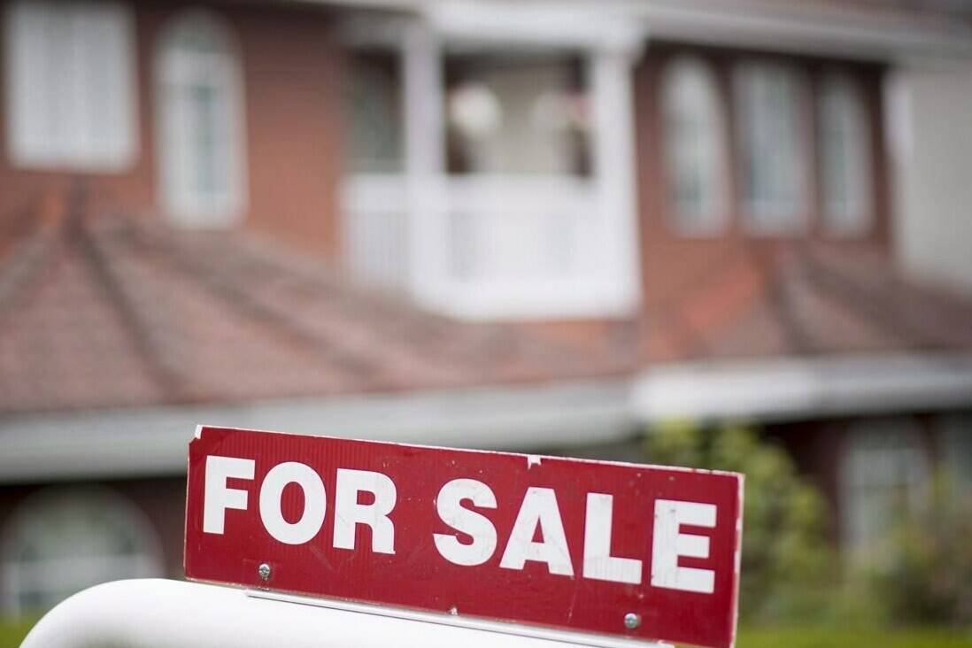 A real estate sign is pictured in Vancouver, B.C., Tuesday, June, 12, 2018.  THE CANADIAN PRESS Jonathan Hayward