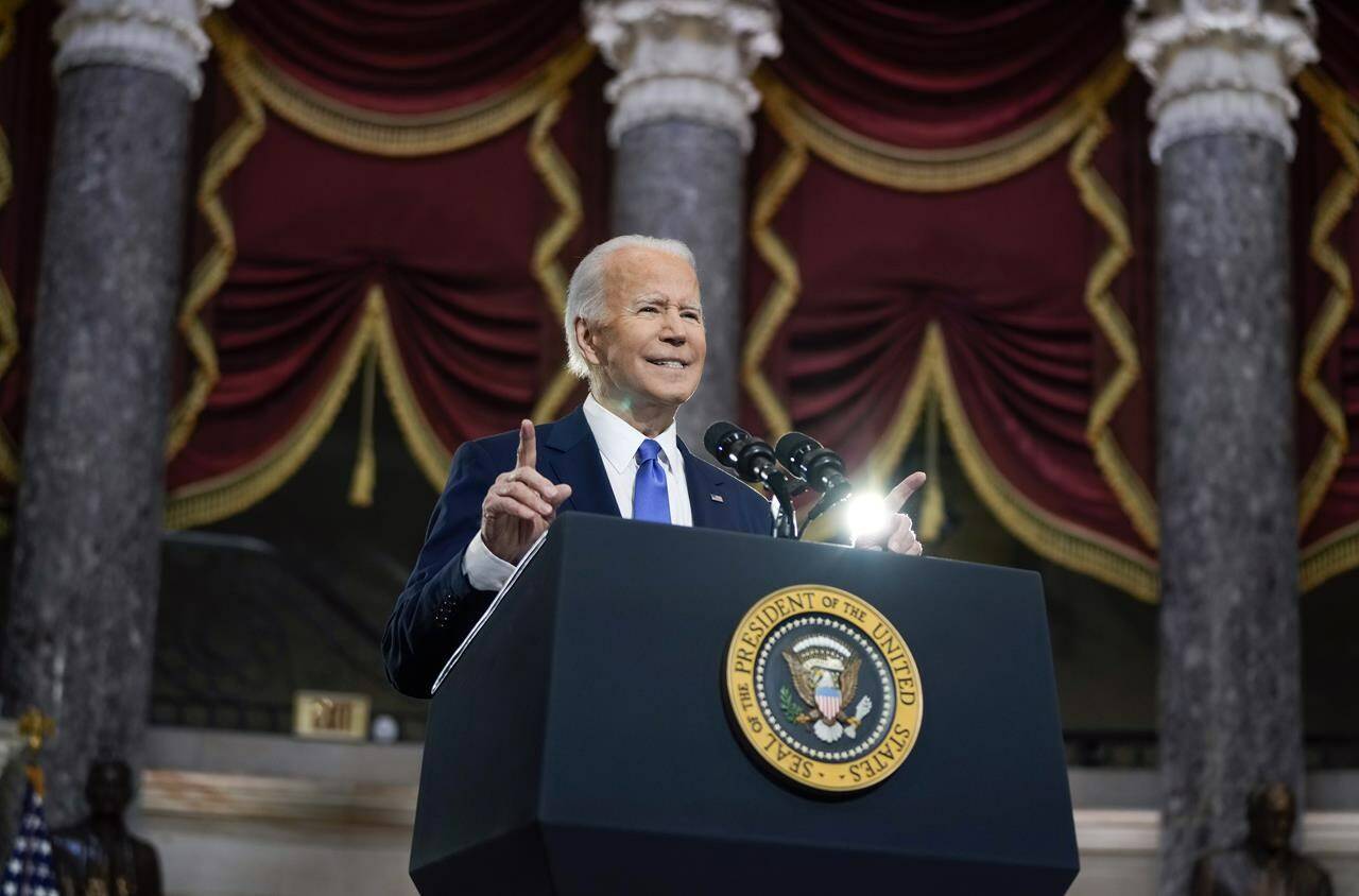 President Joe Biden speaks from Statuary Hall at the U.S. Capitol to mark the one year anniversary of the Jan. 6 riot at the U.S. Capitol by supporters loyal to then-President Donald Trump, Thursday, Jan. 6, 2022, in Washington. THE CANADIAN PRESS/AP-Drew Angerer/Pool via AP
