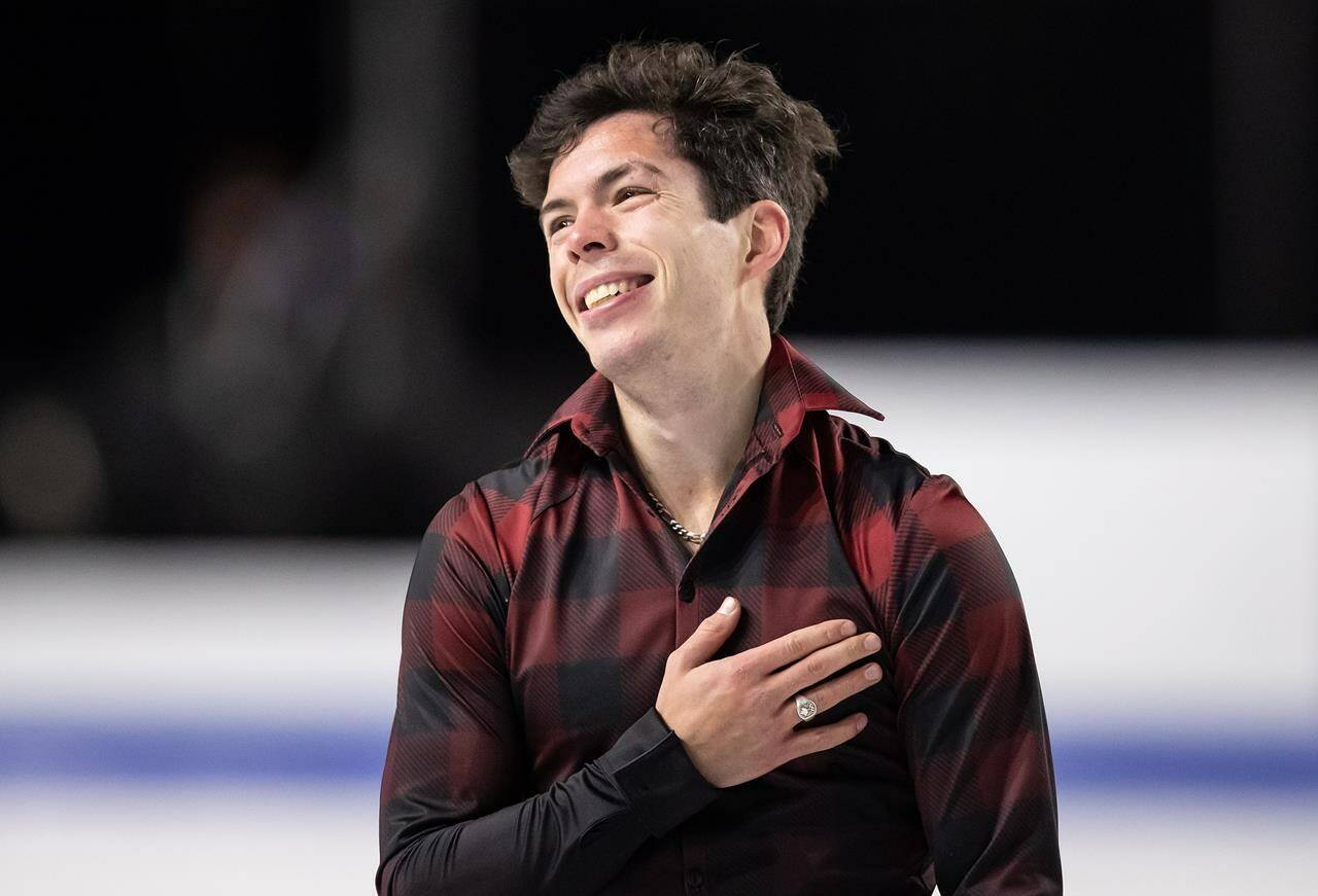 Canada’s Keegan Messing reacts to the crowd after performing his men’s free program during the Skate Canada International figure skating competition, in Vancouver, on Saturday, October 30, 2021. THE CANADIAN PRESS/Darryl Dyck