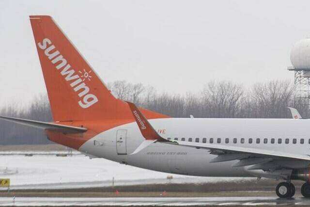 A Sunwing Airlines jet prepares to take off at Montreal's Trudeau International Airport, Friday, March 20, 2020. Experts say the Sunwing party flight might have been halted mid-trip had certain aviation protocols been strictly followed. THE CANADIAN PRESS/Graham Hughes