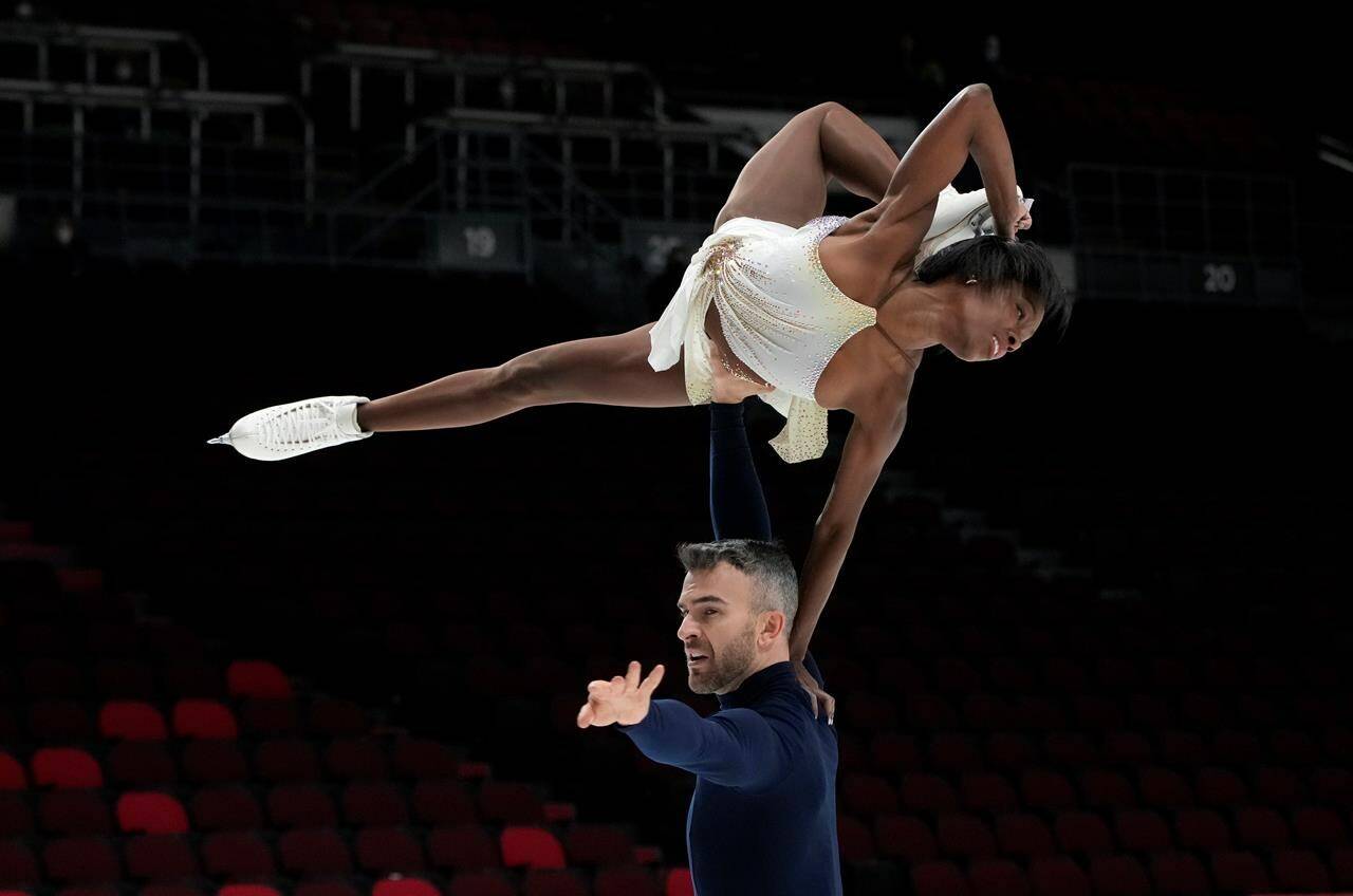 Vanessa James and Eric Radford perform their routine during the senior pairs short program at the National Skating Championships, in Ottawa, Friday, Jan. 7, 2022. THE CANADIAN PRESS/Adrian Wyld