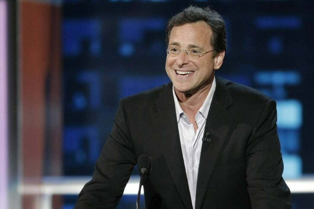 FILE - In this Aug. 3, 2008, file photo, actor and roastee Bob Saget speaks at the "Comedy Central Roast of Bob Saget," in Burbank, Calif. Saget, a comedian and actor known for his role as a widower raising a trio of daughters in the sitcom “Full House,” has died, according to authorities in Florida, Sunday, Jan. 9, 2022. He was 65. (AP Photo/Dan Steinberg, File)