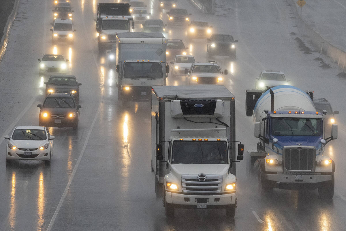 Traffic moves along highway 1 as heavy rains form an atmospheric river continue in Burnaby, B.C., Tuesday, November 30, 2021. THE CANADIAN PRESS/Jonathan Hayward