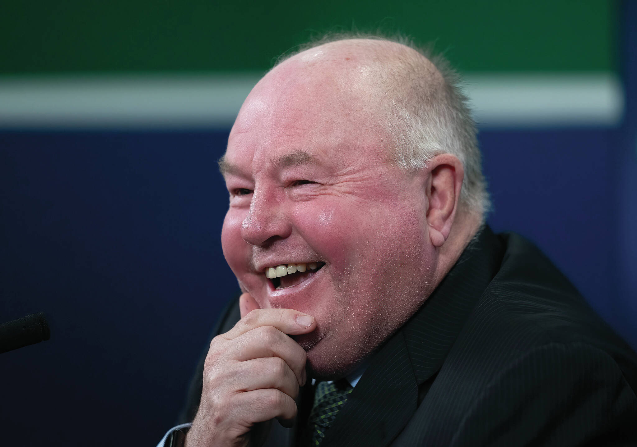 Vancouver Canucks new head coach Bruce Boudreau smiles as he attends a news conference in Vancouver, B.C. (File photo by The Canadian Press)