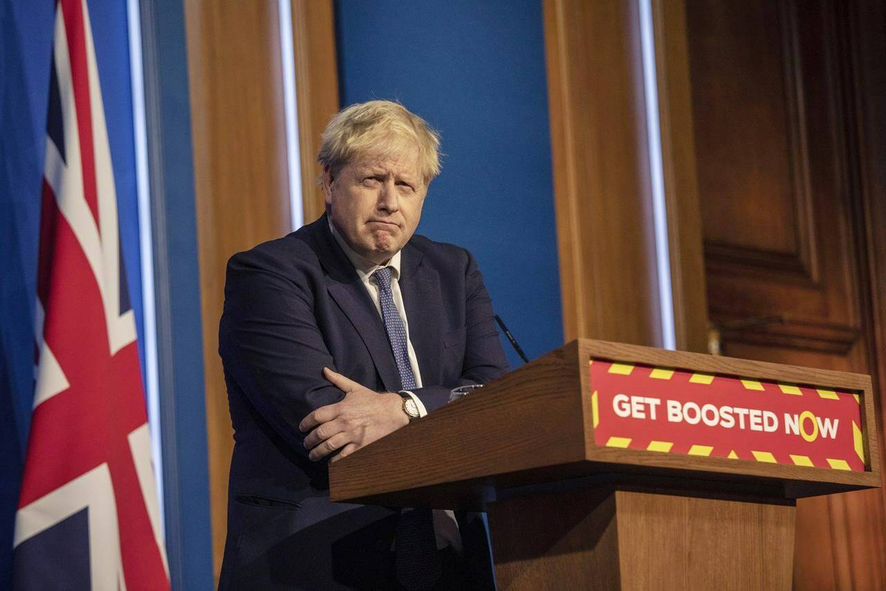 FILE - Britain’s Prime Minister Boris Johnson pauses during a coronavirus media briefing in Downing Street, London, Tuesday, Jan. 4, 2022. (Jack Hill, Pool Photo via AP, File)