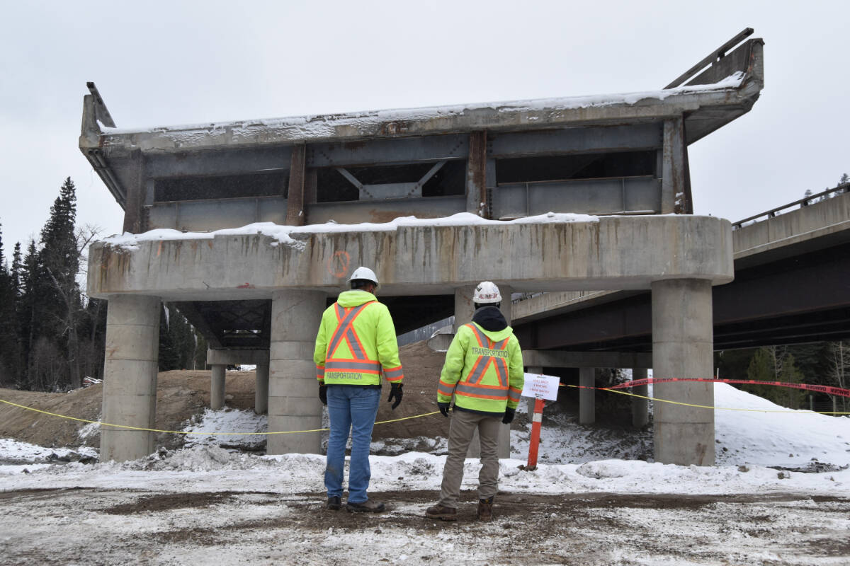 Ministry of Transportation staff survey the damage at the last remaining northbound strand of Bottletop Bridge. (Cole Schisler/Black Press)