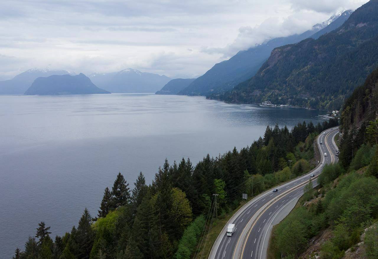 Motorists travel on the Sea-to-Sky Highway between Horseshoe Bay and Lions Bay, B.C., on Friday, April 23, 2021. Avalanche Canada says there is a high risk of avalanches in the Sea-to-Sky region and across the South Coast as snow melts and a series of atmospheric rivers brings up to 15 centimetres of rain in some parts of the region. THE CANADIAN PRESS/Darryl Dyck