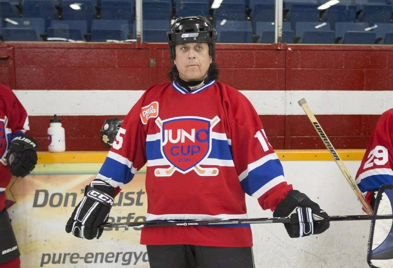 Vince Fontaine of Eagle & Hawk waits for a scrimmage to begin during practice for the Juno Cup celebrity hockey game at the Dave Andreychuk Mountain Arena in Hamilton, Ont., on Thursday, March 12, 2015. Family, friends, and the music industry in Manitoba are in mourning after Fontaine, a multi-award-winning First Nations musician, died suddenly this week in Winnipeg. THE CANADIAN PRESS/Peter Power