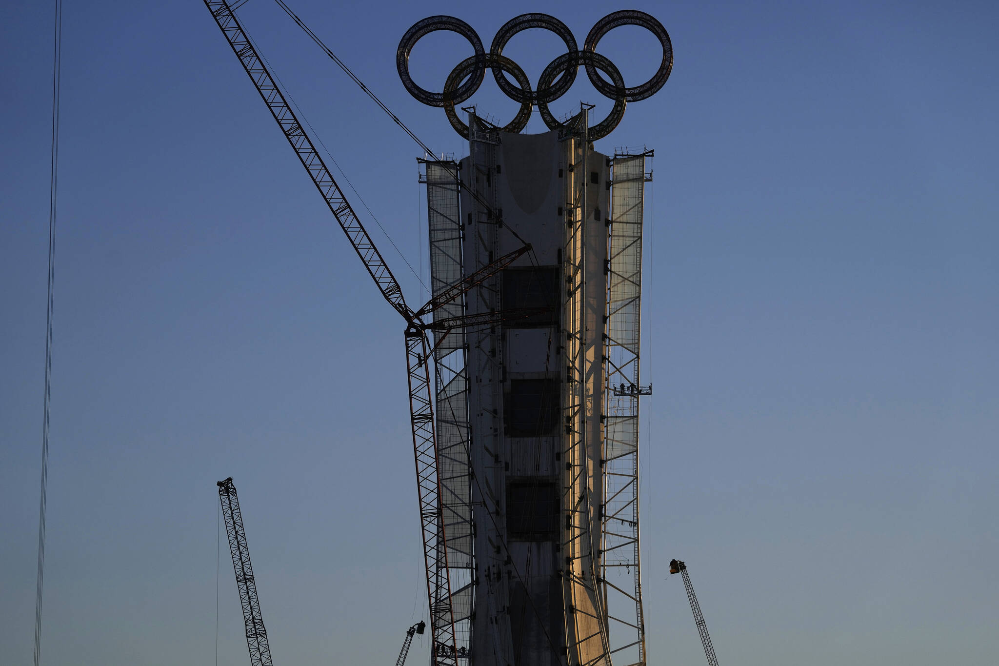 Olympic Rings assembled atop of a structure stand out near a ski resort on the outskirts of Beijing, China, Thursday, Jan. 13, 2022. (AP Photo/Ng Han Guan)