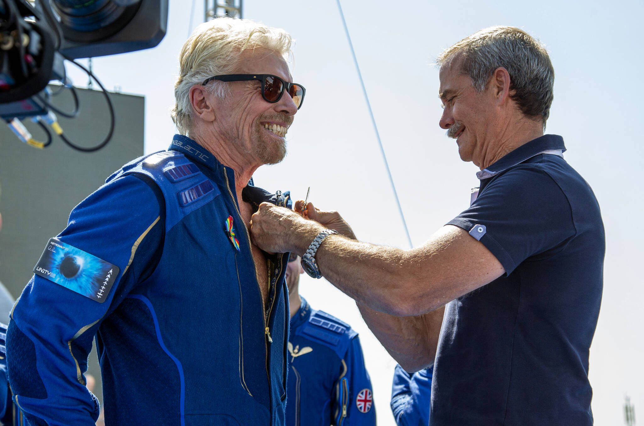 Virgin Galactic founder Richard Branson, left, receives his astronaut wings pin from Canadian astronaut Chris Hadfield, after a space flight in 2021. Hadfield says privatized space flight has its benefits to life on earth. (AP Photo/Andres Leighton)